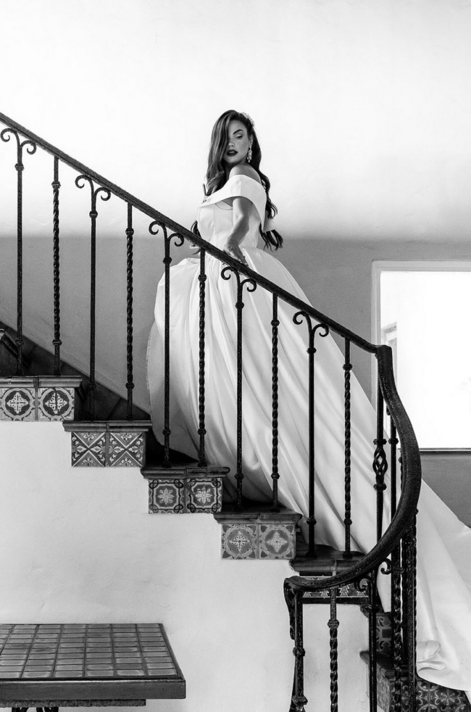 Bride posing for a photographer at Villa Woodbine in Miami, Florida 